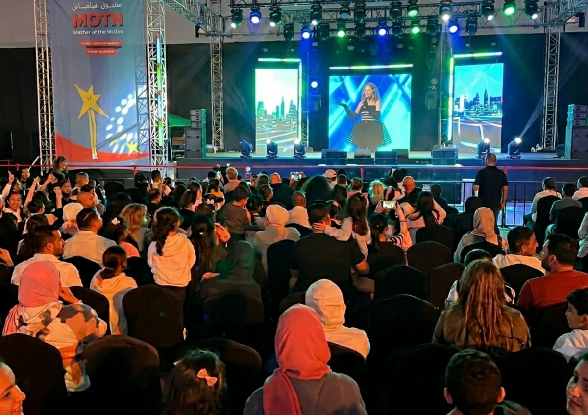 Families watching a live creator performance at MOTN