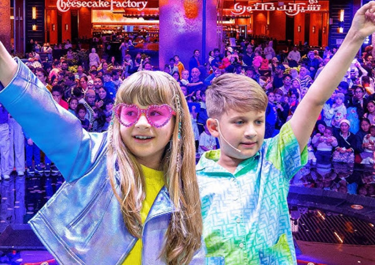 Kids creators celebrating on stage in front of a crowd